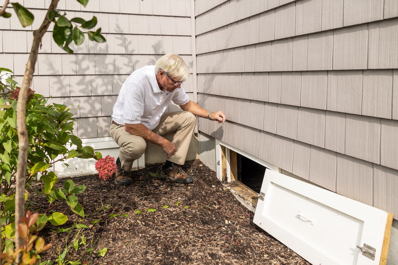 Inspector checking a home's crawl space